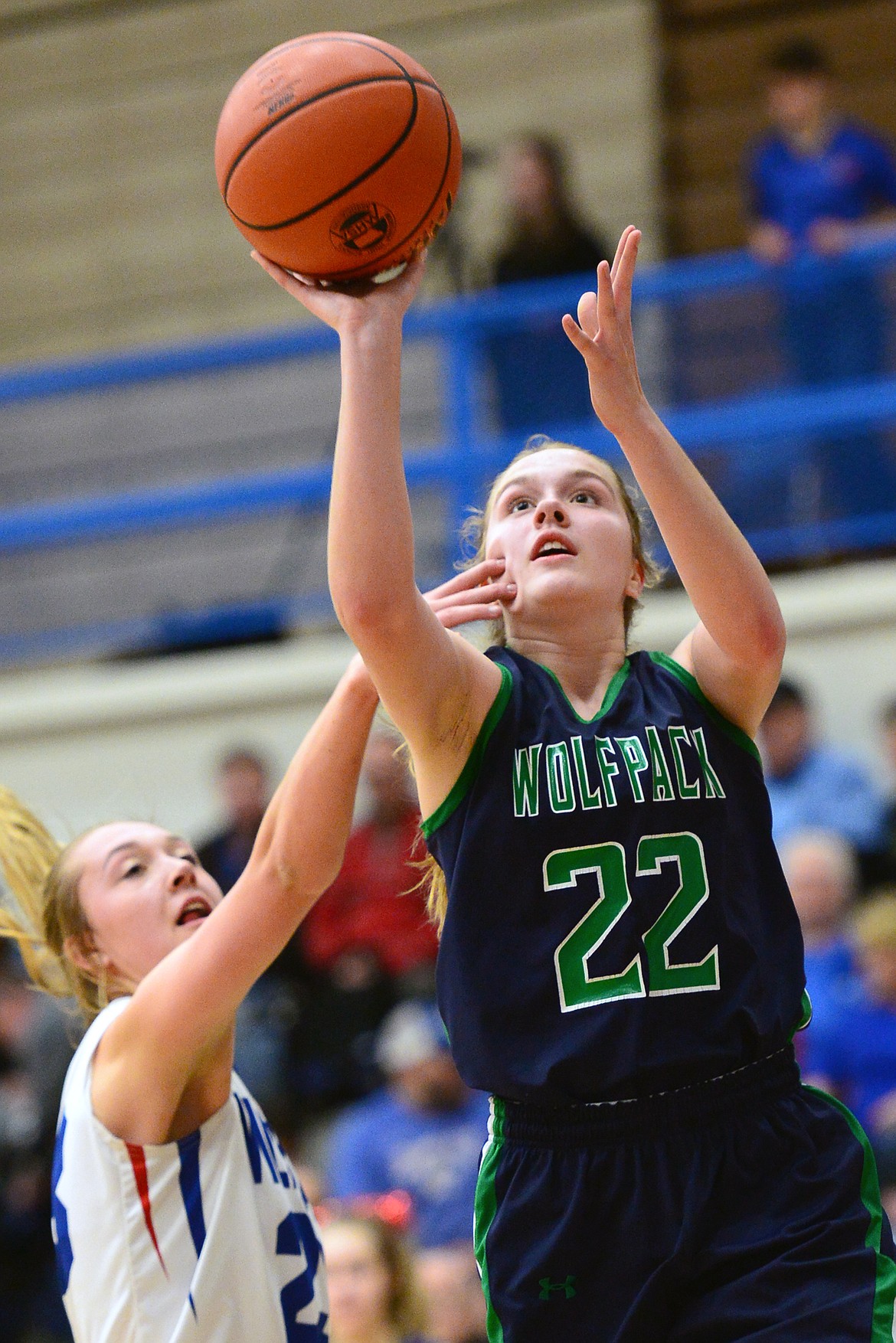 Glacier's Ellie Keller (22) shoots over Columbia Falls Ryley Kehr (23) at Columbia Falls High School on Thursday. (Casey Kreider/Daily Inter Lake)