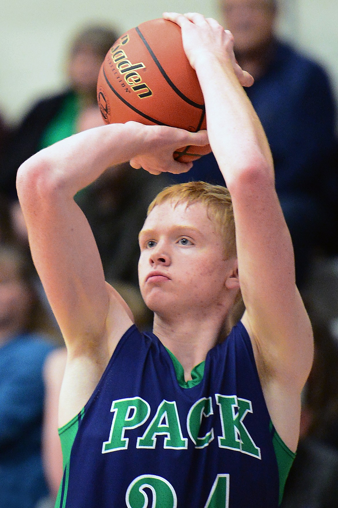 Glacier's Bret Michaels (34) drops in a fourth-quarter three-pointer against Columbia Falls at Columbia Falls High School on Thursday. (Casey Kreider/Daily Inter Lake)