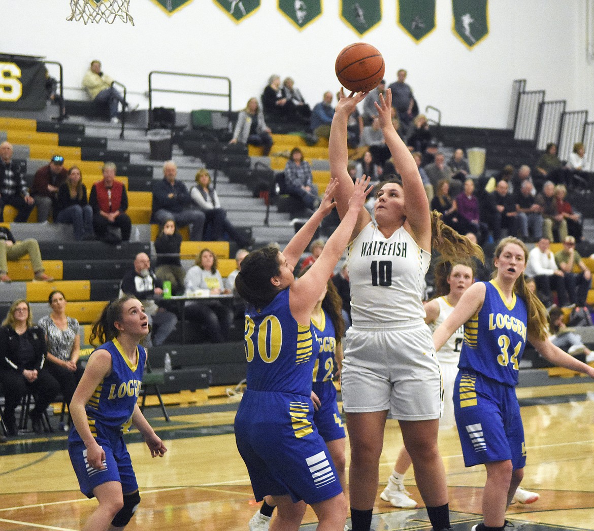 Hope Brown puts up a layup during Friday's home loss to the Lady Loggers. (Daniel McKay/Whitefish Pilot).