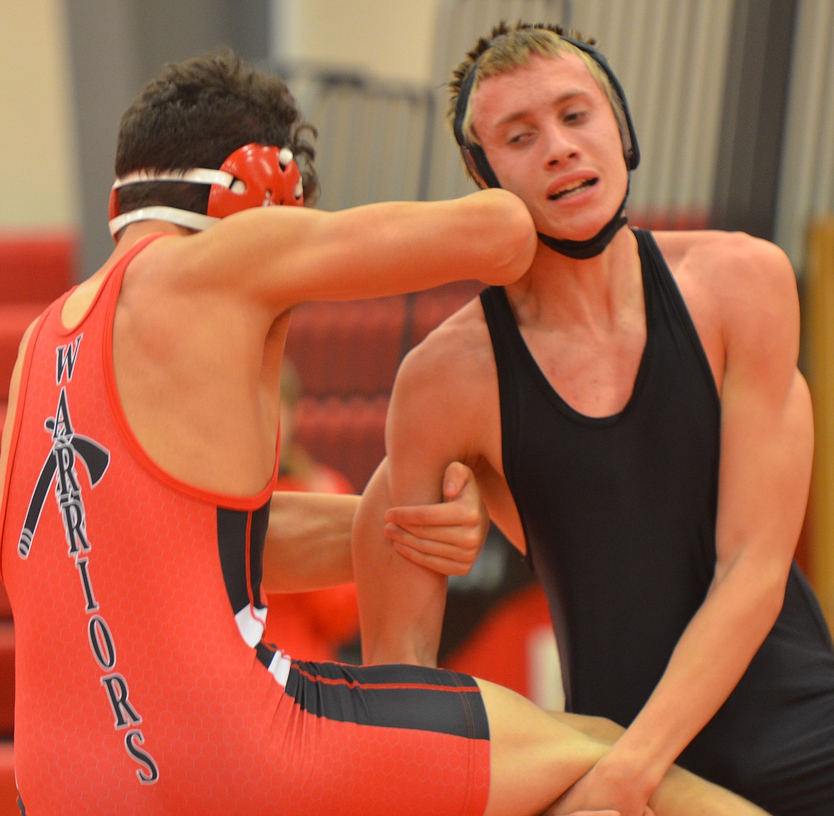 Plains/Hot Springs grappler Bert DeTienne, right, gets a grip on Kanoa Palazzolo of Arlee during an Arlee Quad match. (Joe Sova/Clark Fork Valley Press)