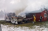 Camper destroyed, house damaged in afternoon fire in Hungry Horse