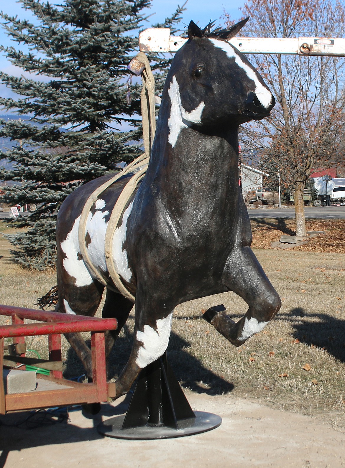 The first of five life-size wild horse statues constructed by Kenton Pies of Plains was placed on Montana Rail Link property south of MTWest Dentist on Highway 200 last Friday. Pies had help from Andy Gonzales in constructing the pinto. (Lisa Larson/Clark Fork Valley Press)