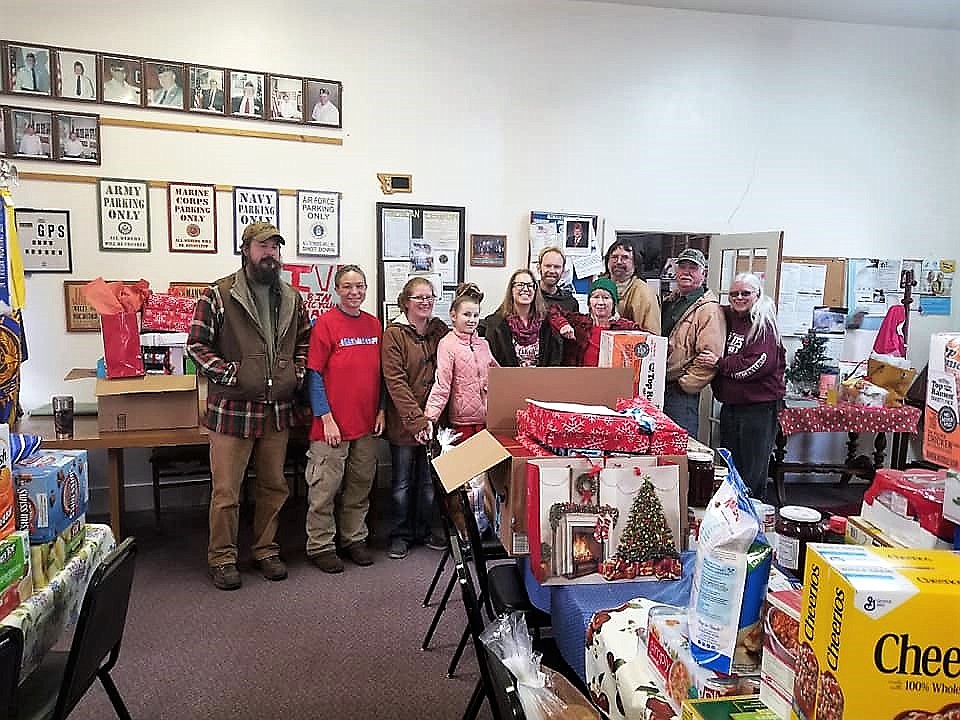 Members of Alberton&#146;s Helping Hands put together baskets for local families this Christmas season at the community center on Dec. 15. (Photos courtesy of Helping Hands)