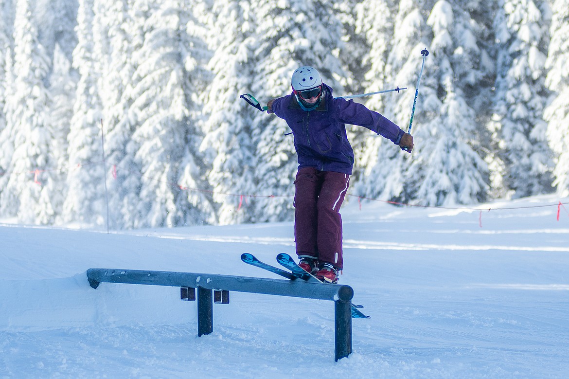 A skier hits the rails on Whitetail during opening day at Whitefish Mountain Resort.