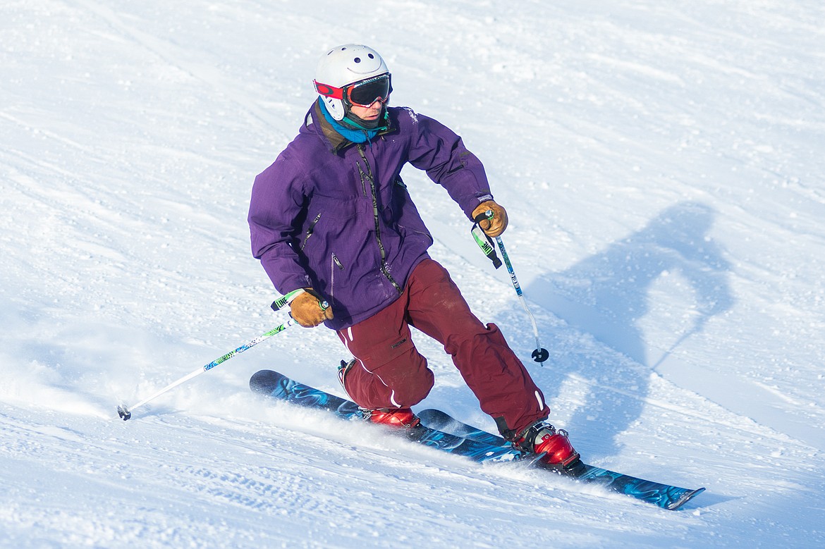 A smooth tele-skier makes some turns down the Ant Hill on opening day at Whitefish Mountain Resort.