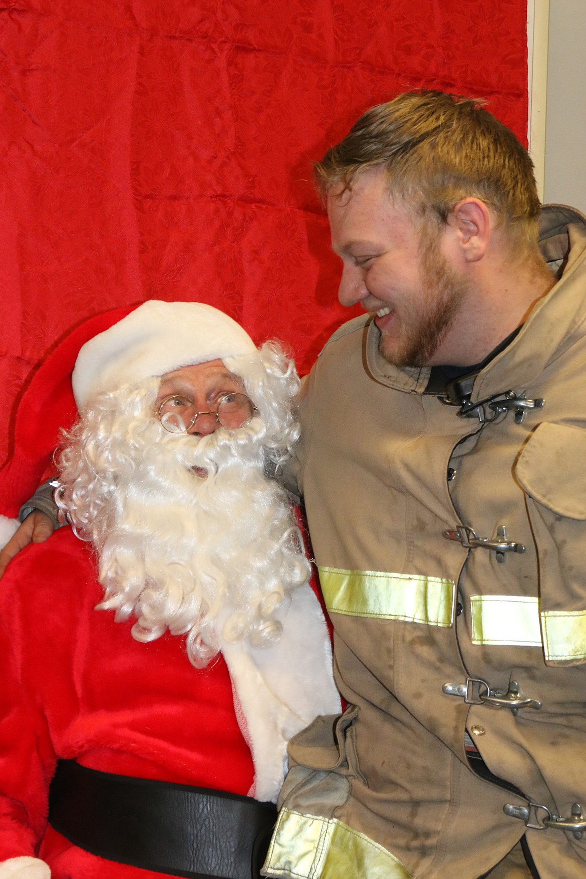 Photo by MANDI BATEMAN
Even firefighters had a chance to tell Santa what they wanted for Christmas.