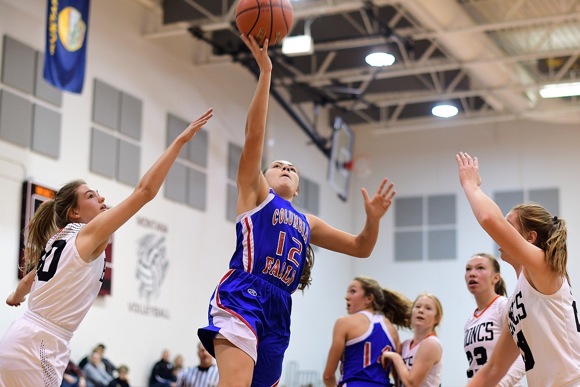 LaKia Hill drives past several Lady Broncs for a layup in the Wildkats 41-36 win over Frenchtown at the Western A Tip Off Tournament in Missoula Saturday. Hill finished with 11 points in the victory. (Jeremy Weber photo)