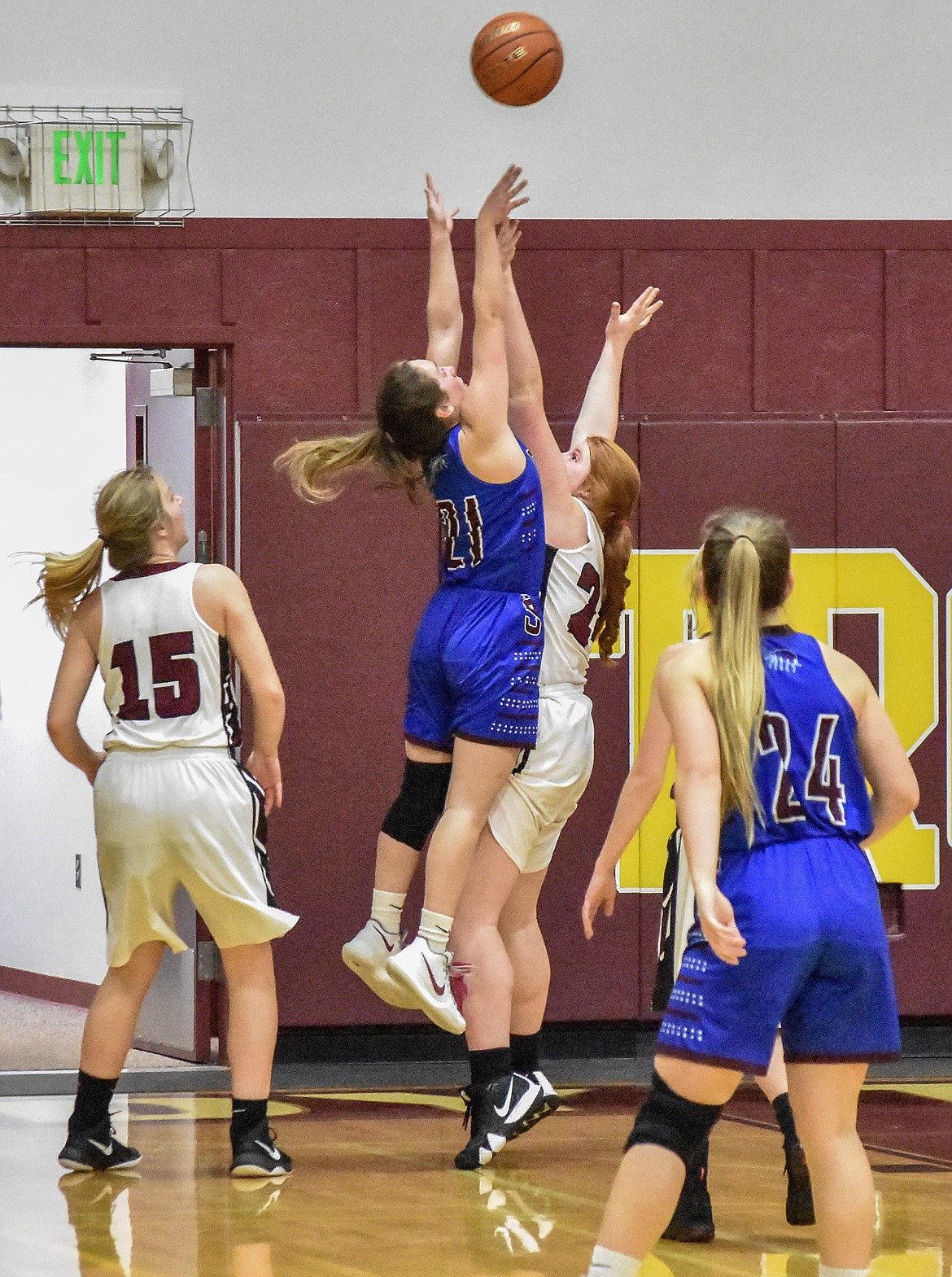 CLARK FORK&#146;S Madison Mask, who scored 26 points, goes over Troy&#146;s Montana Rice during Thursday&#146;s Lady Mountain Cats&#146; win. (Ben Kibbey/The Western News)