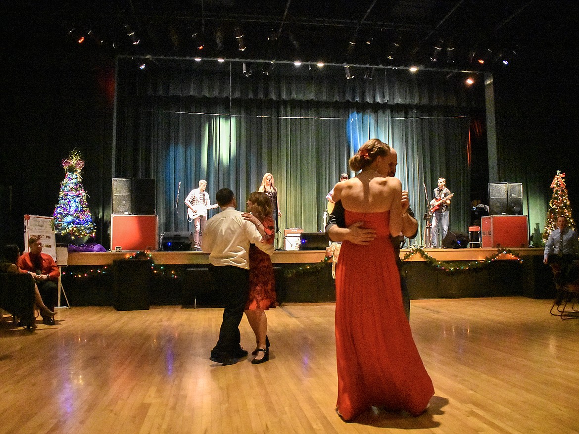 Couples start to trickle onto the dance floor early in the evening Saturday during the annual Festival of Trees Fundraising Gala. (Ben Kibbey/The Western News)