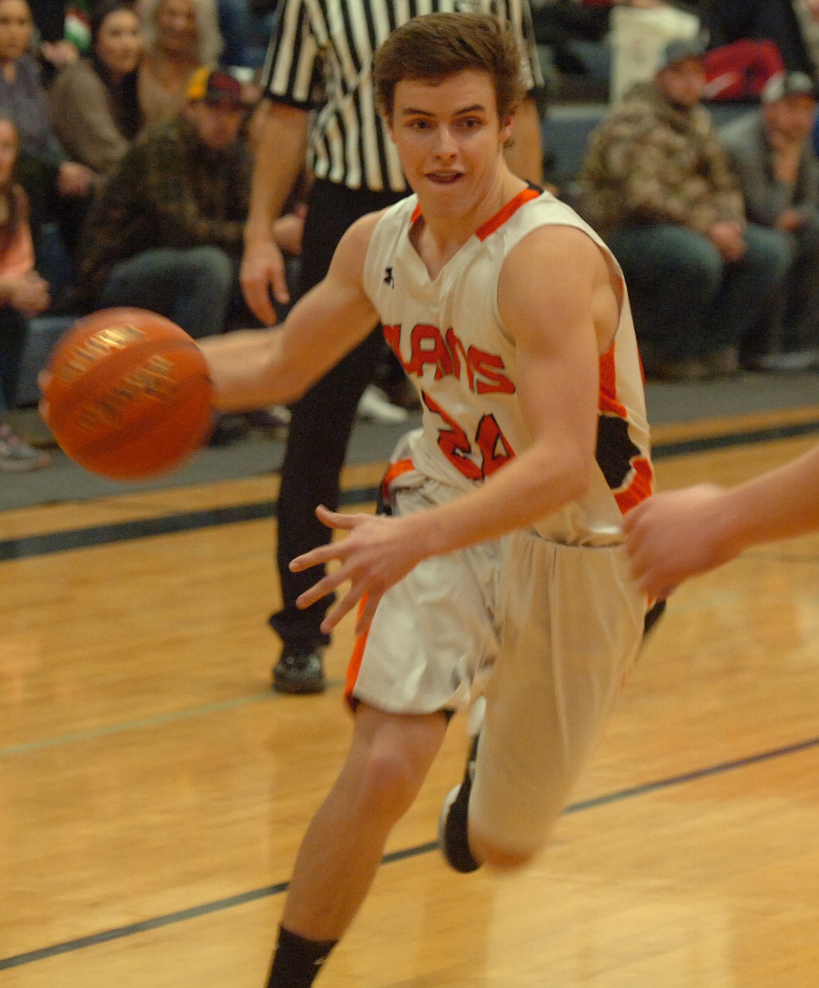 Nathan McNulty of Plains heads for the basket during last Saturday&#146;s loss to Darby in the Horsemen home opener. (Joe Sova/Clark Fork Valley Press)