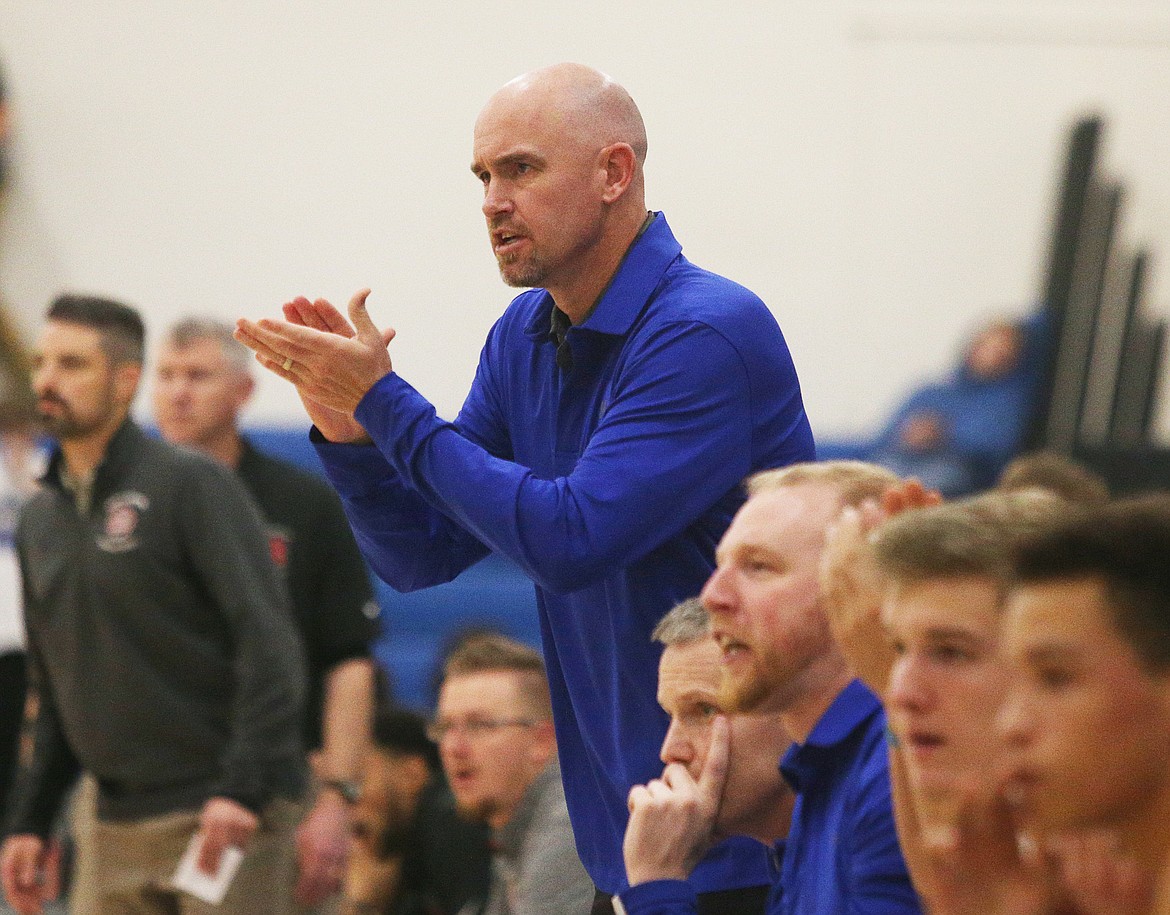 Coeur d&#146;Alene boys head coach Tony Hanna cheers on his team during Friday night&#146;s game against North Central.