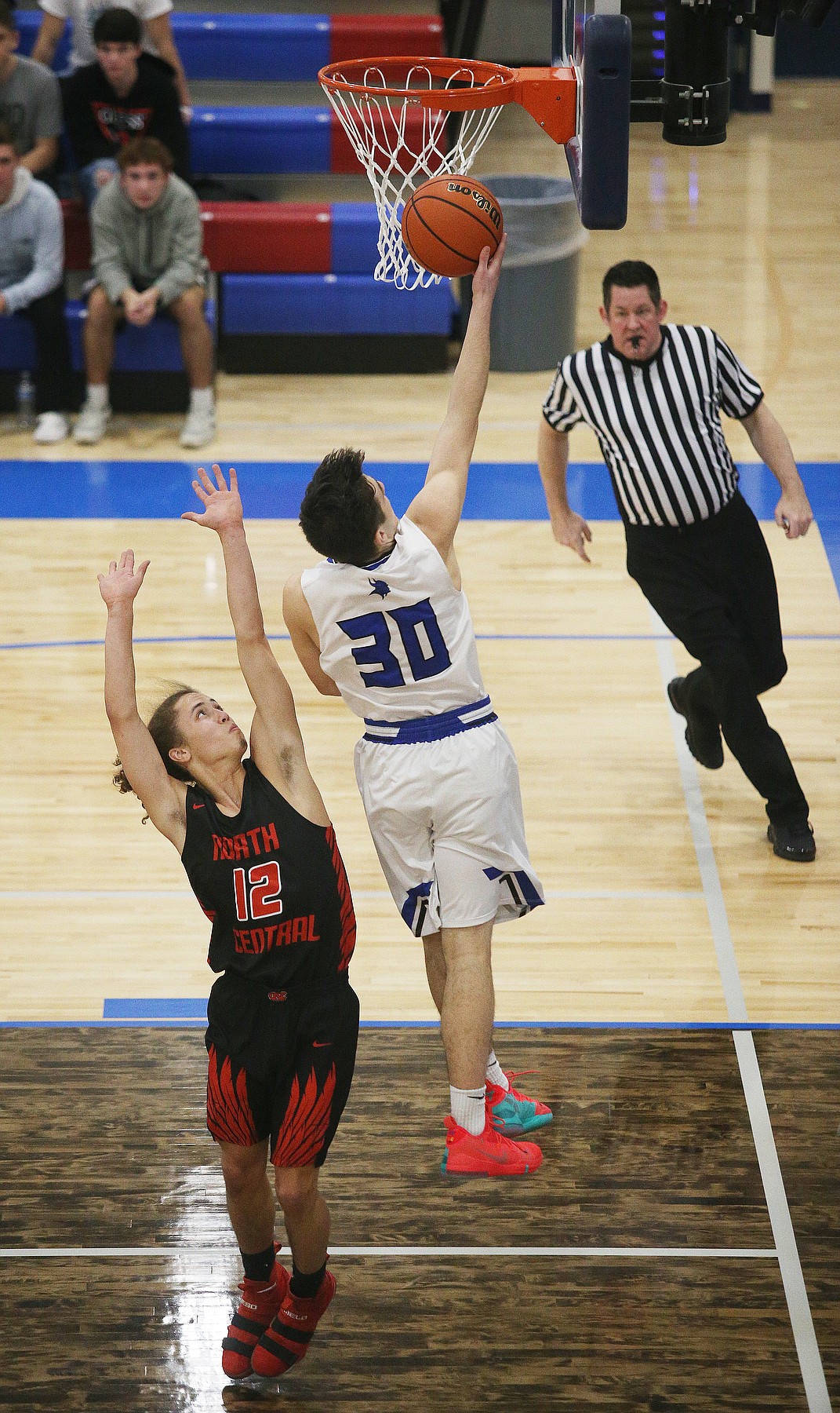 Coeur d&#146;Alene&#146;s Gavin Margo goes for a layup against North Central&#146;s Parish Neil.