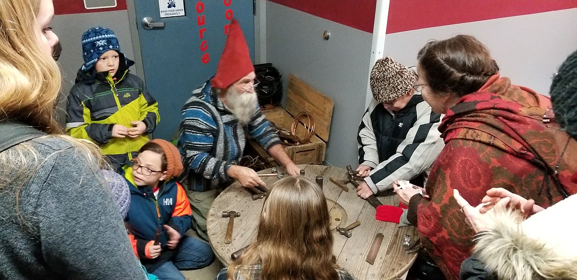 Photo by MANDI BATEMAN
Weezil had a booth where kids and adults could learn how to make rings.