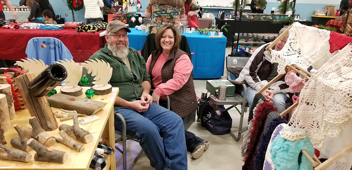 Photo by MANDI BATEMAN
Rory and Kally Kramer with their items for sale at the Naples Holiday Festival Craft Fair.