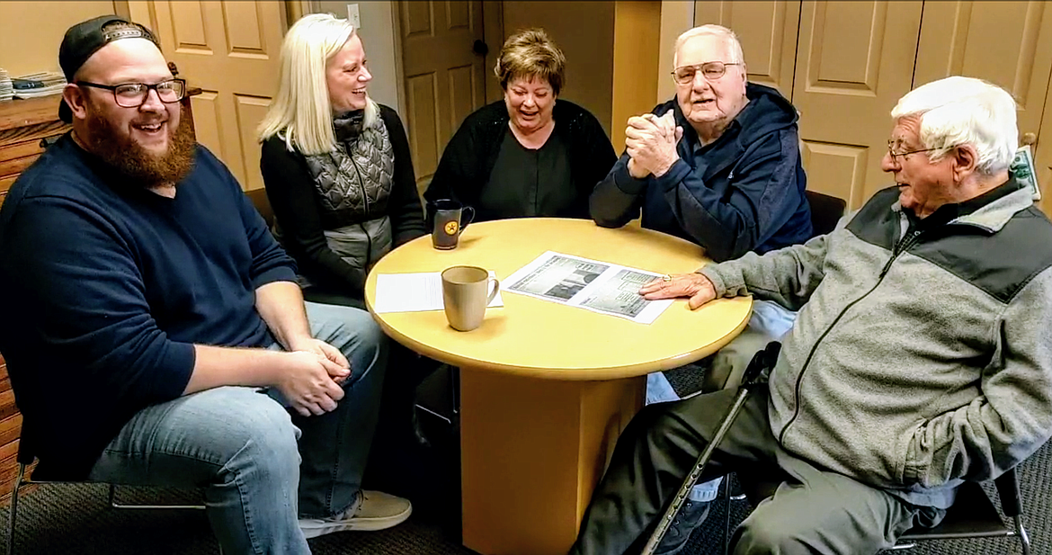 Photo by CHANSE WATSON
Shoshone News-Press reporter Josh McDonald interviews Paul Robinson, George White, Peggy White and Keri Alexander to kick off the Dave Smith Christmas Fund Telethon. The group shared several laughs reminiscing about past radiothons back at KWAL.
