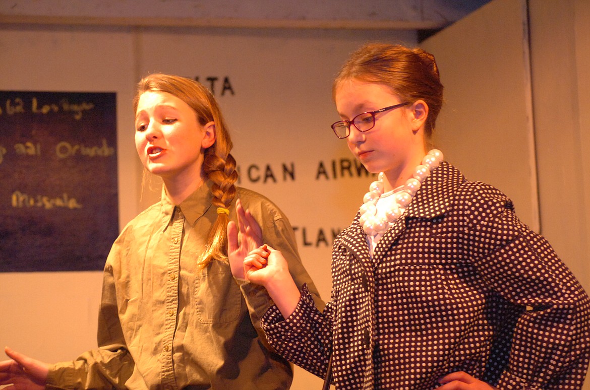 The Plains School Drama Department took on a classic play written by Megan Orr at the Sanders County Fairgrounds Pavilion. Above, MRA airline hostess Vanessa Fairchild (Blakely Lakko) has a discussion with Mary Schneider (Peyton Wasson), one of the mothers whose families spend Christmas Eve and Day at the airport.