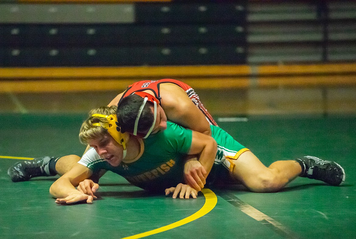 Camren Ross fights off a Browning wrestler during Friday&#146;s dual at Whitefish High School. (Daniel McKay/Whitefish Pilot)