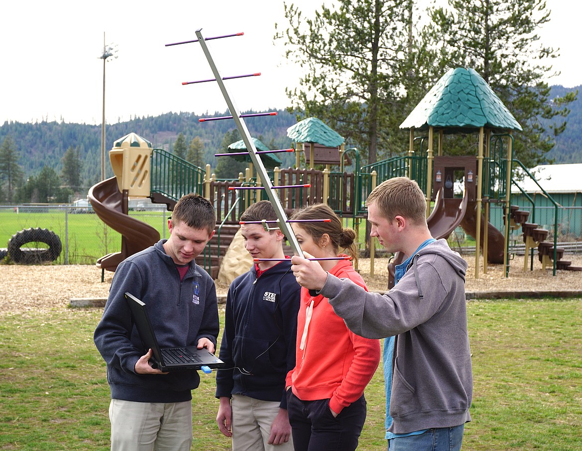 From left, Project DaVinci team members Justin Kugler, Austin Kugler, Paige Pence and Joe Benson track satellites with scientific equipment earlier this year. The team, from North Idaho STEM Charter Academy, is the only K-12/high school team that was selected to participate in NASA's CubeSat Space Mission in 2016 and is the only Idaho team participating this launch year. The Project DaVinci satellite will finally launch into space from New Zealand on Wednesday evening. (Courtesy photo)