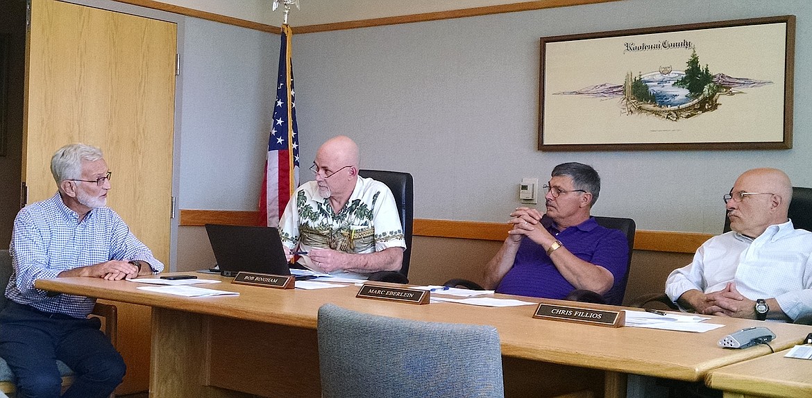 Steve Meyer, a partner in Parkwood Business Properties, far left, discusses Kootenai County facilities with commissioners Bob Bingham, Marc Eberlein and Chris Fillios in this September 2018 file photo. The county in 2019 is expected to continue to wrestle with facility questions brought on by tight working quarters and a rise in demand for services due to population growth. (BRIAN WALKER/Press file photo)
