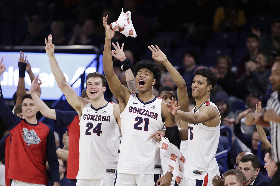 YOUNG KWAK/Associated Press
Gonzaga forward Corey Kispert (24), forward Rui Hachimura (21) and forward Brandon Clarke celebrate on the bench during the second half of Friday&#146;s romp over Denver.