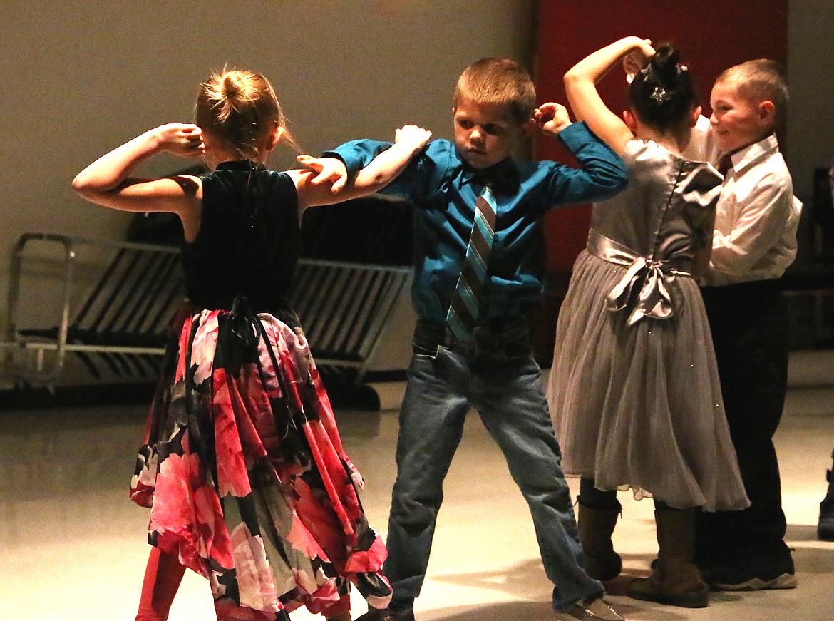 Idaho Hill Elementary first- and second-graders swing danced to &#147;Santa Claus is Coming to Town&#148; during the school&#146;s winter music program on Dec. 12.

(Photo by 
MARY MALONE)