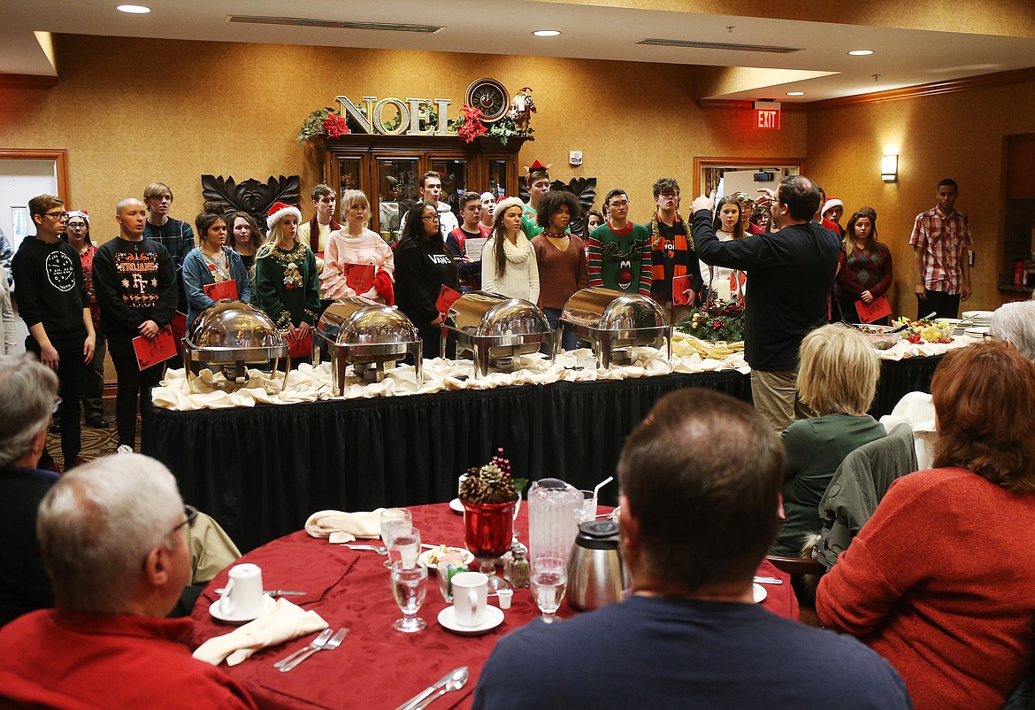 The Post Falls High School choir sings &quot;O Holy Night,&quot; and a variety of other Christmas songs for Post Falls Rotary Club members last Wednesday at Garden Plaza. (LOREN BENOIT/Press)