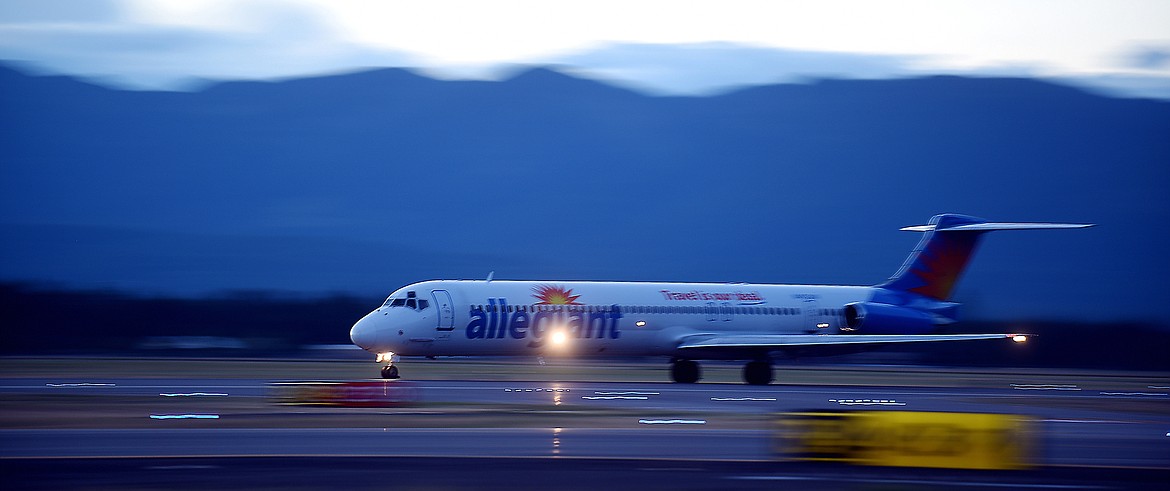 An Allegiant aircraft streaks across the main runway at Glacier Park International Airport in 2015. (Brenda Ahearn/Daily Inter Lake)