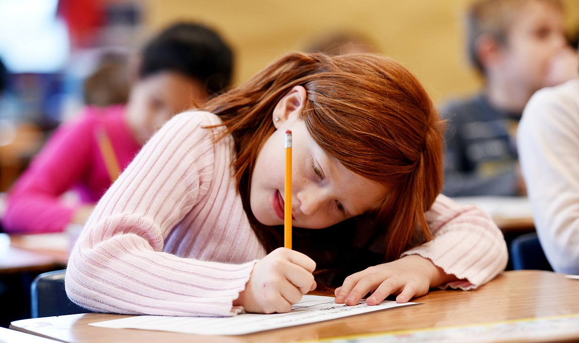 Elizabeth &#147;Lizzy&#148; Holien focuses on an in class assignment in Kitty Dowaliby&#146;s second grade on Monday, November 30, 2015 at Muldown Elementary School in Whitefish. For the 2014-15 school year Muldown had between 598-606 students. At the beginning of this year the number of students enrolled is 647.
(Brenda Ahearn/Daily Inter Lake)