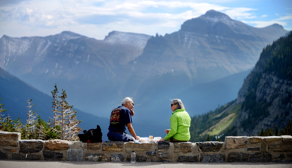 Friends enjoy a lunch with a view at Logan Pass on Sept. 17, 2014 in Glacier National Park. (Brenda Ahearn/Daily Inter Lake)