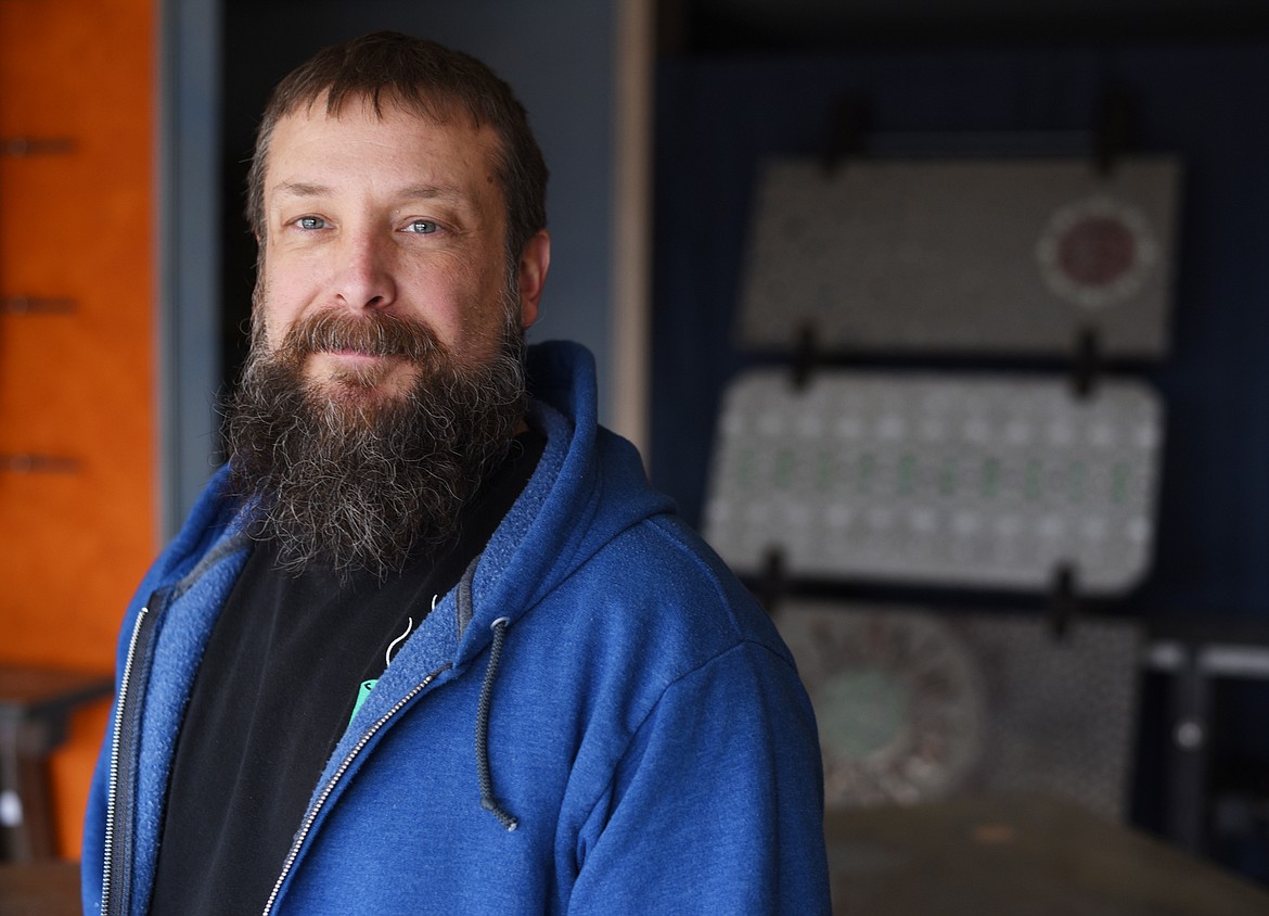 Portrait of artist Trevor Osburn in his new shop V.O.I.D. Veer Off Industrial Designs, in downtown Kalispell just south of Bias Brewing. Osburn has a long history of doing custom home construction.(Brenda Ahearn/Daily Inter Lake)