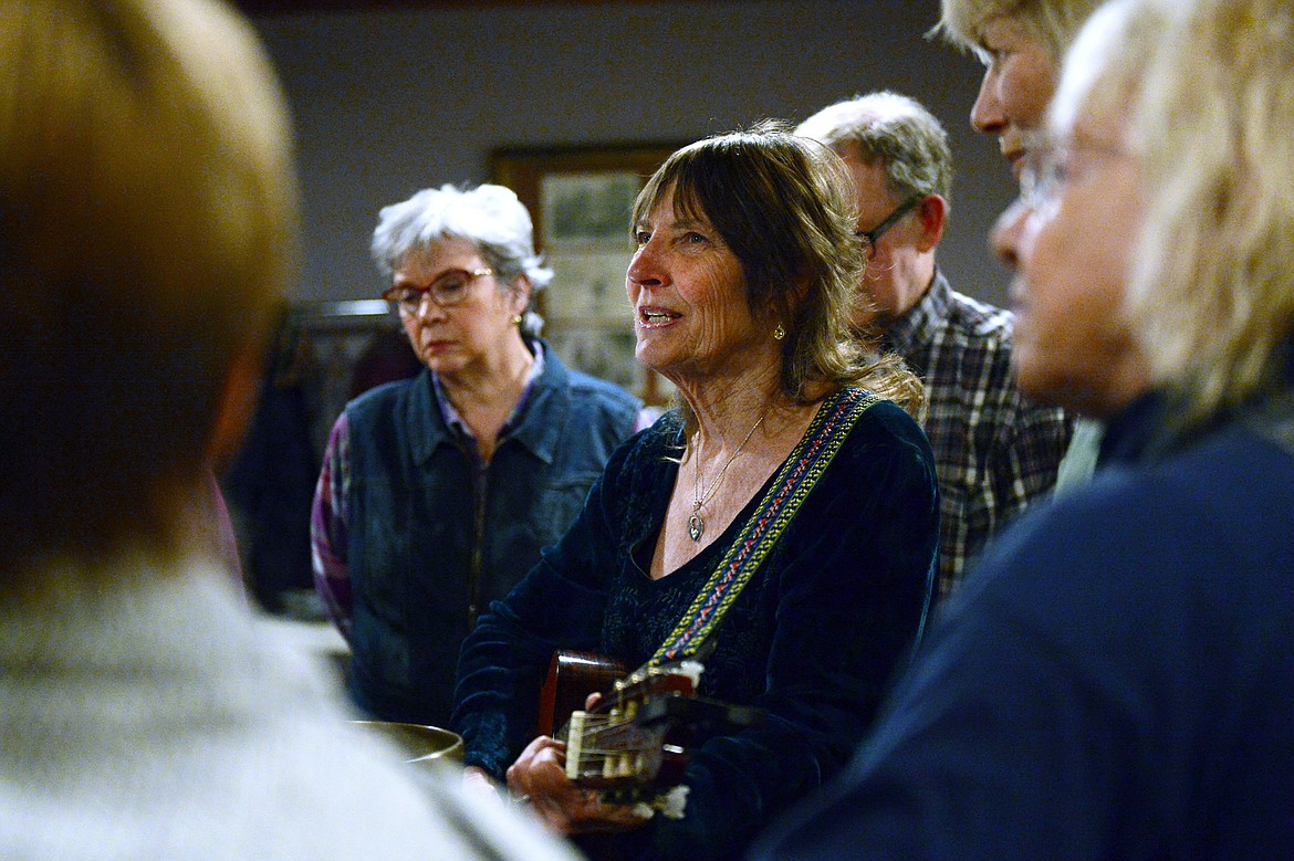 Carla Hannaford plays guitar while helping to lead Dances of Universal Peace at Shining Mountains Center for Spiritual Living in Kalispell on Wednesday, Dec. 19. (Casey Kreider/Daily Inter Lake)