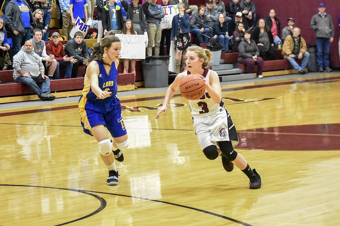 Troy senior Annie Day charges down court early in the first quarter quarter against Thompson Falls Friday.  (Ben Kibbey/The Western News)