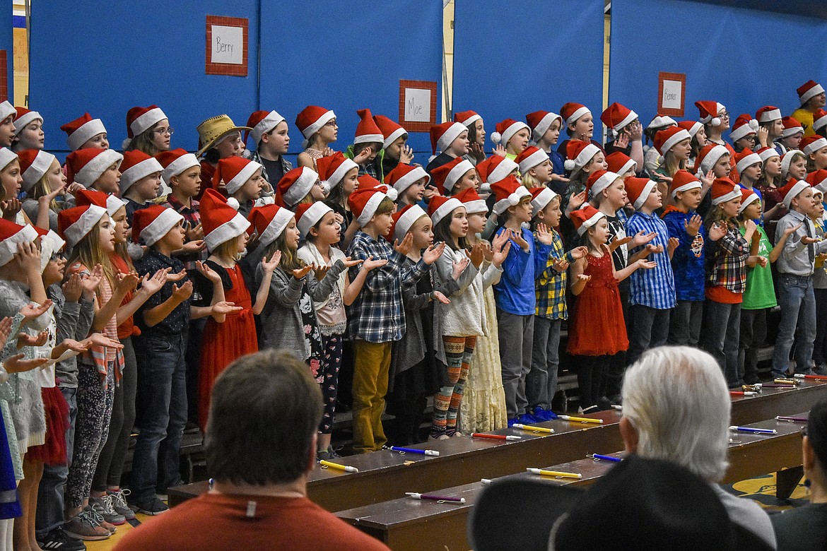 Libby 4th and 5th grade students perform during their Christmas concert at the Libby Elementary School gym Thursday. (Ben Kibbey/The Western News)