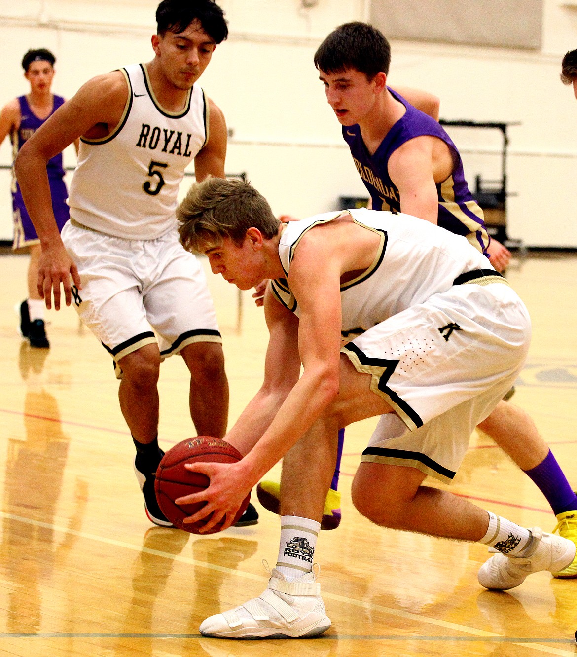 Rodney Harwood/Columbia Basin Herald
6-foot-5 Royal senior Sawyer Jenks hustles over to make the save on the sidelines on a loose ball during the first half of Saturday's game with Goldendale.