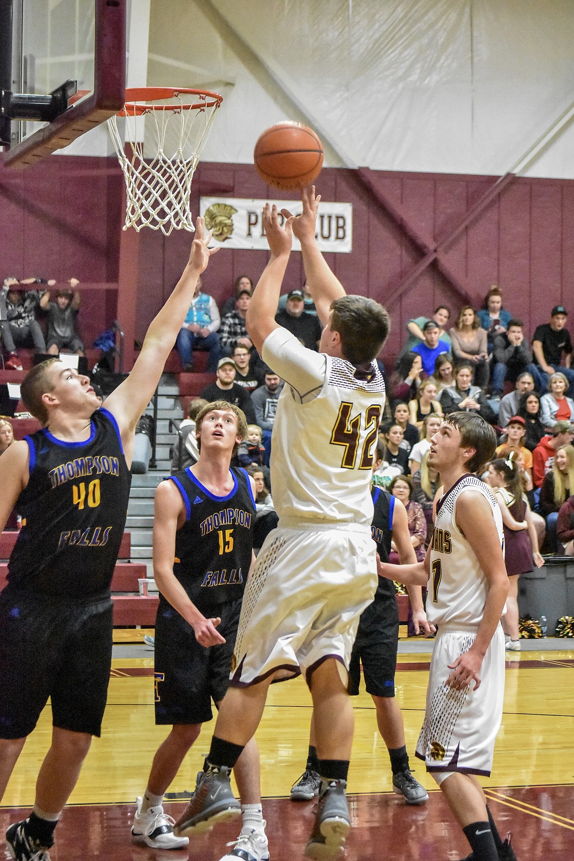 Troy senior Alex Freund shoots for two, giving the Trojans a 6-5 lead in the first quarter against Thompson Falls Friday. (Ben Kibbey/The Western News)