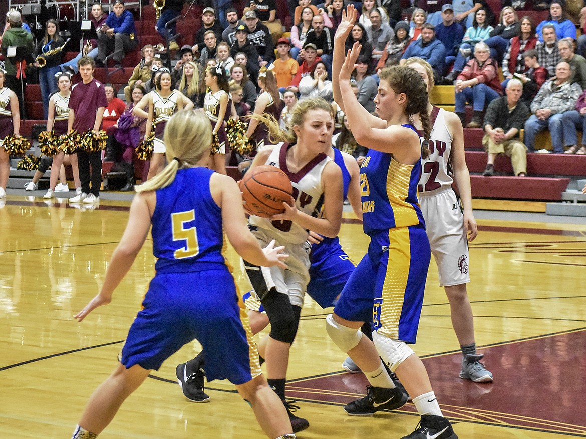 Troy senior Annie Day charges into the Thompson Falls defense on her way to the basket during the fourth quarter Friday.  (Ben Kibbey/The Western News)