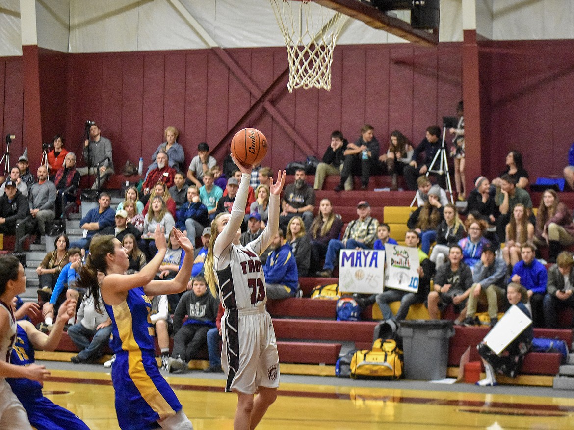 Troy junior Katelynn Tallmadge scores late in the third quarter against Thompson Falls Friday, narrowing the lead to 23-21, Lady Bluehawks. (Ben Kibbey/The Western News)