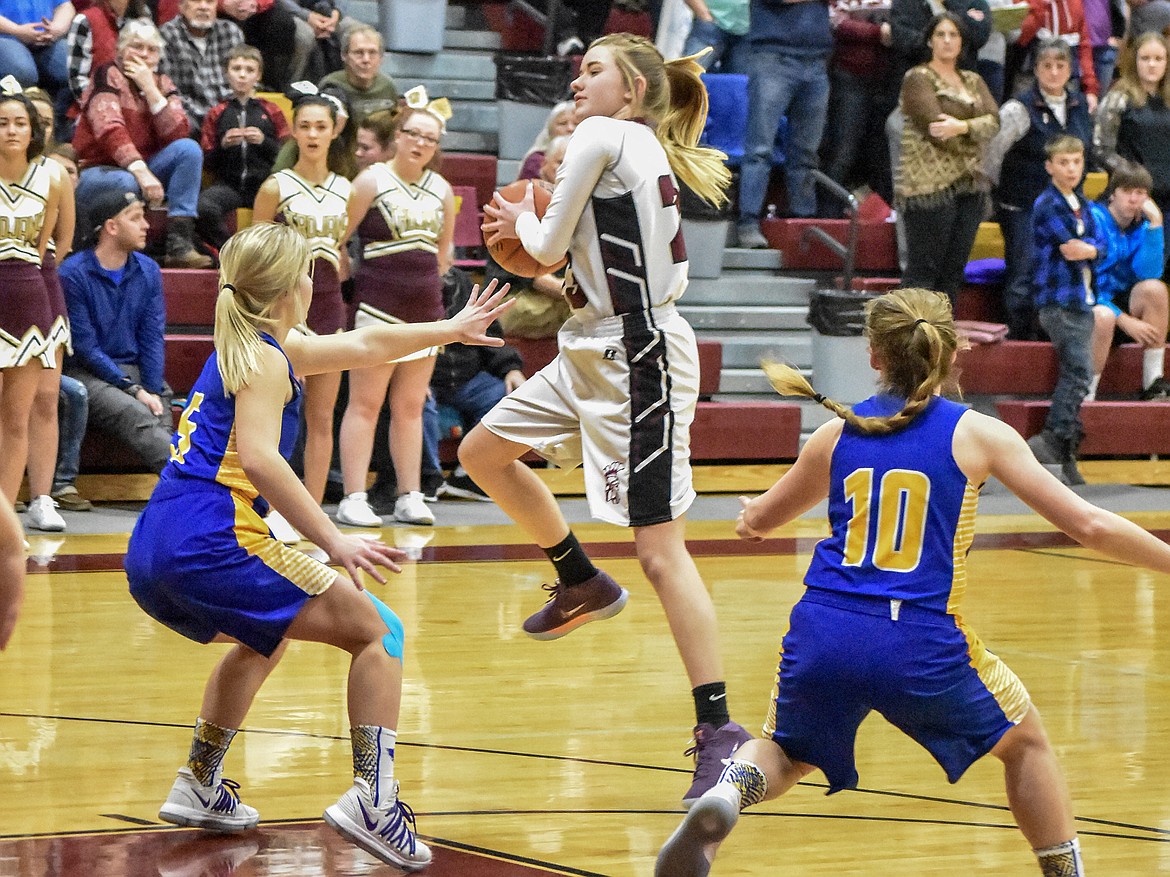 Troy junior Katelynn Tallmadge catches a pass early in the first quarter against Thompson Falls Friday. (Ben Kibbey/The Western News)