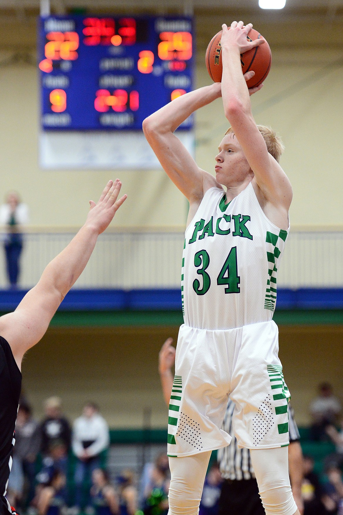 Glacier's Bret Michaels (34) shoots a three-pointer in the second quarter against Bozeman at Glacier High School on Friday. (Casey Kreider/Daily Inter Lake)