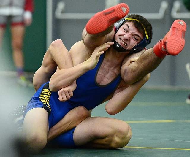 Libby sophomore Cody Crace Works toward a pin of Hamilton&#146;s Cole Anson at 152 lbs. At Whitefish High School on Thursday (Casey Kreider/Daily Inter Lake)