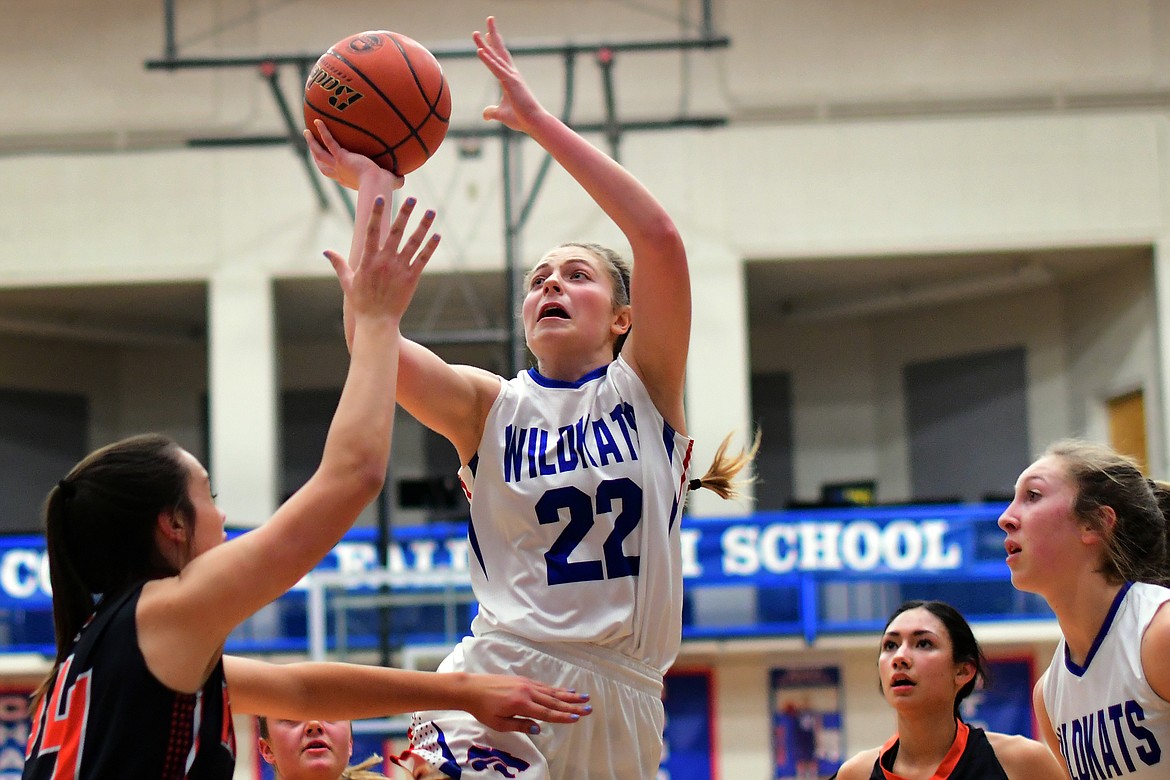 Hannah Schweikert takes the ball up for a shot in the second quarter against Ronan Friday. Schweikert and the Wildkats erased a 14-point deficit to pick up a 40-27 win over the visiting Maidens. (Jeremy Weber photo)