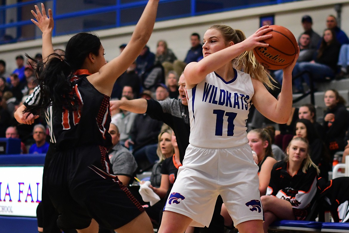 Savvy Ellis looks to protect the ball during action in the opening quarter against Ronan Friday. (Jeremy Weber photo)