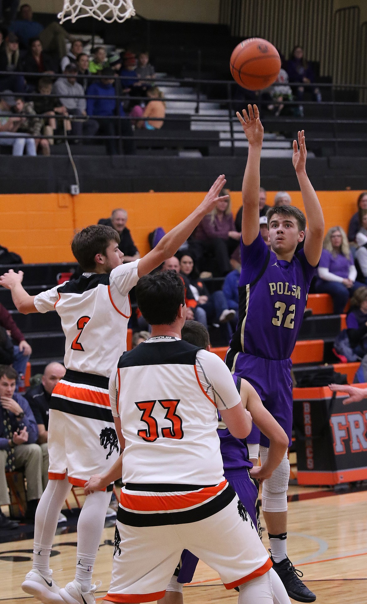 Polson freshman Colton Graham (32) shoots over a pair of Frenchtown defenders during the Dec. 18 game at Frenchtown. Graham scored 19 points in a 52-50 Pirates loss. (Bob Gunderson/Lake County Leader)