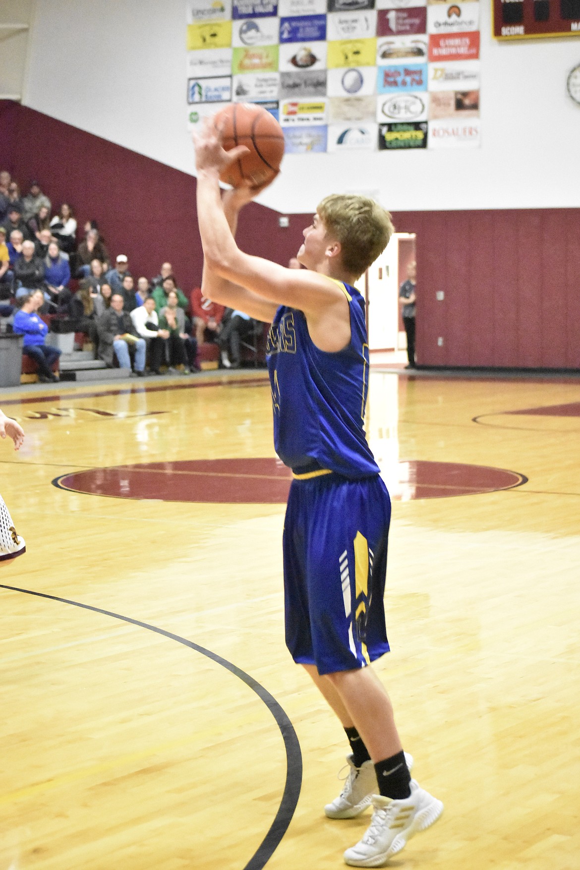 Libby junior Chandler Bower sets up a three point shot at Troy Tuesday. (Ben kibbey/The Western News)