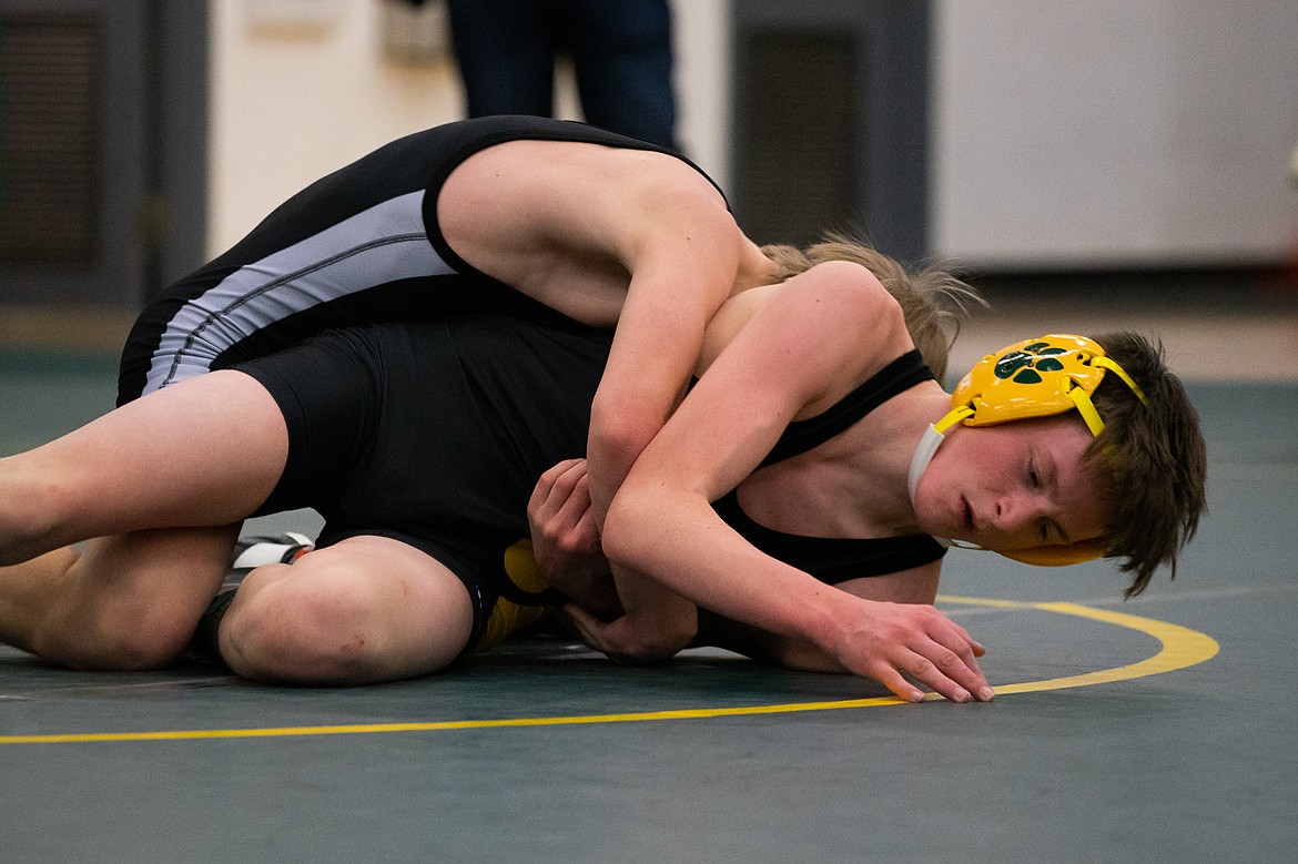 Jackson Carson wrestles Frenchtown&#146;s Eli Warner Thursday at Whitefish High School. (Daniel McKay/Whitefish Pilot)