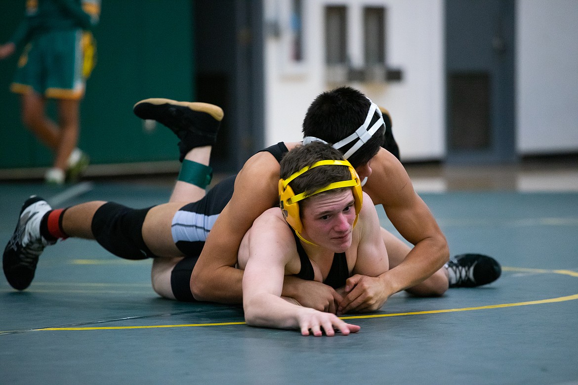 Leroy Orel wrestles Frenchtown&#146;s Jake Bibler Thursday at Whitefish High School. (Daniel McKay/Whitefish Pilot)