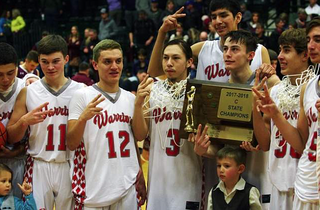 The Arlee Warriors celebrate their second straight Class C state basktball title in March. (File photo)