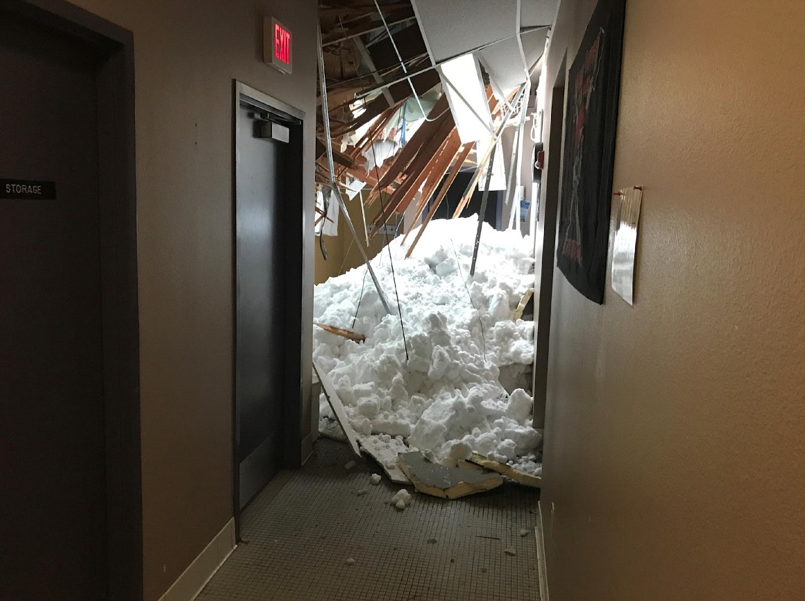 Mounds of snow and ice come to rest inside the Linderman Elementary gym Jan. 6, 2018. Nearly one year land multiple discussions and reports later, the school district and an insurance company are finally making progress over payment, administration says. (Photo courtesy Polson District Schools)