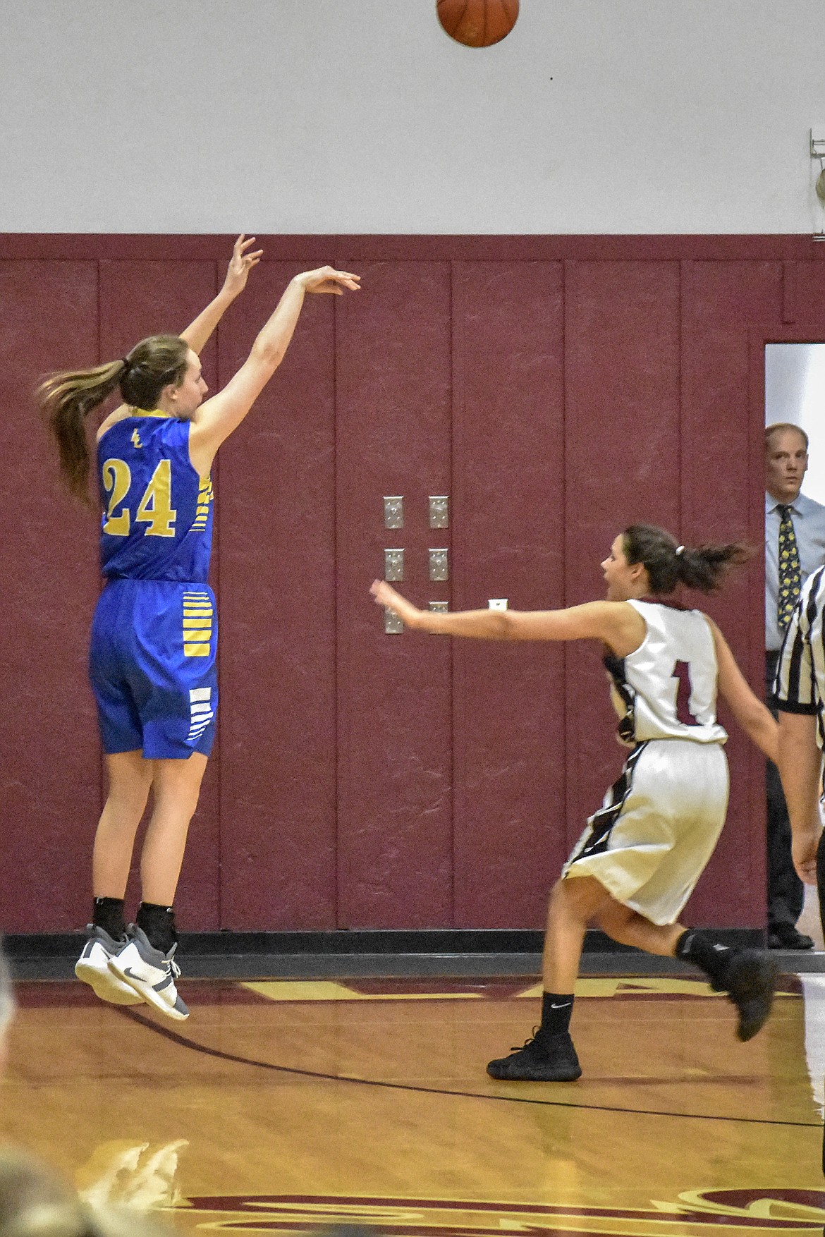 Libby senior Jayden Winslow makes a three-point shot early in the fourth quarter against Troy at Troy Tuesday. (Ben Kibbey/The Western News)