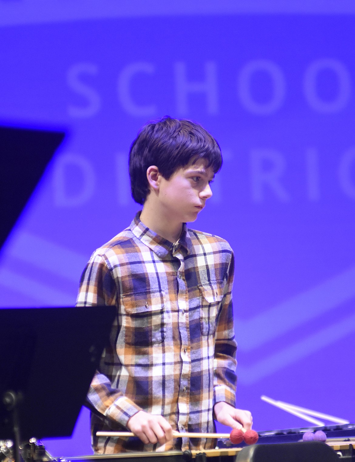 Eighth-grader Cody Hoover plays the vibraphone during the middle school winter band concert. (Heidi Desch/Whitefish Pilot)